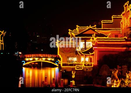 Buildings lit up at night, Nanjing, Jiangsu Province, China Stock Photo