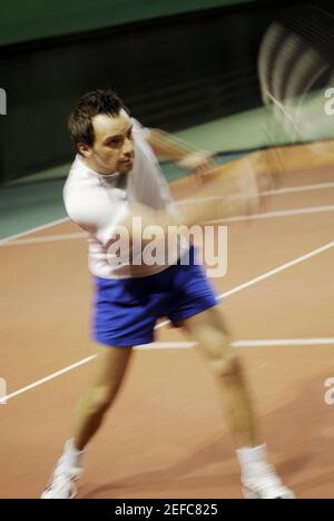 Close-up of a mid adult man playing tennis Stock Photo