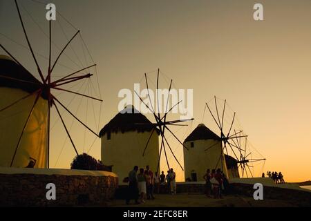 Low angle view of traditional windmills at dusk, Mykonos, Cyclades Islands, Greece Stock Photo