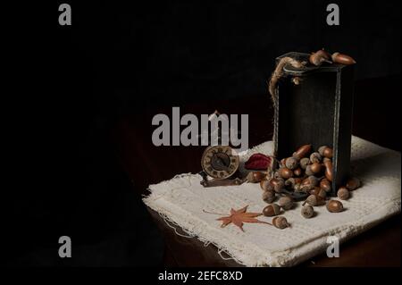 Material of autumn acorn on linen with retro style decorations. Stock Photo