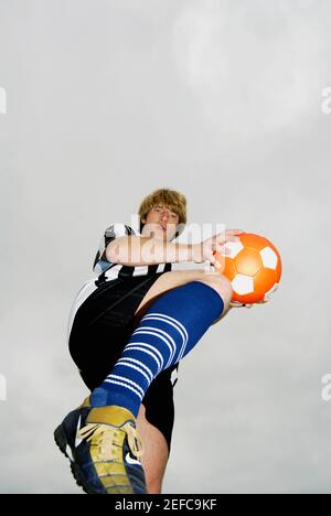 Low angle view of a soccer player practicing Stock Photo