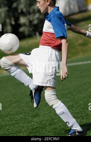 Balancing the Soccer Ball stock photo. Image of focused - 43310912