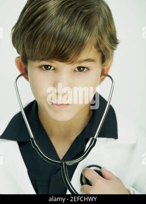 Portrait of a boy dressed as a doctor Stock Photo