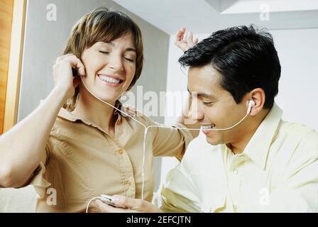 Close up of a couple listening to music Stock Photo