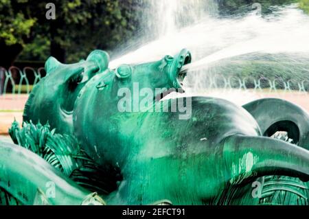 Water spraying from the mouth of a bronze statue, Clarence Buckingham Fountain, Chicago, Illinois, USA Stock Photo