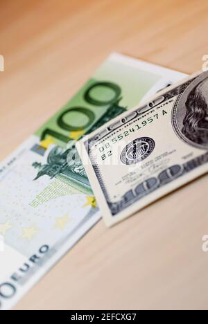 Close up of one hundred Euro banknote and one hundred dollar bill Stock Photo