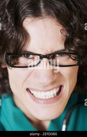 Portrait of a male doctor clenching his teeth Stock Photo