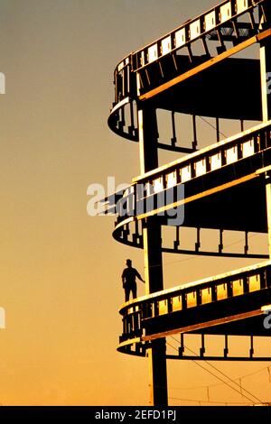 Silhouette of Construction supervisor inspecting high rise. Stock Photo
