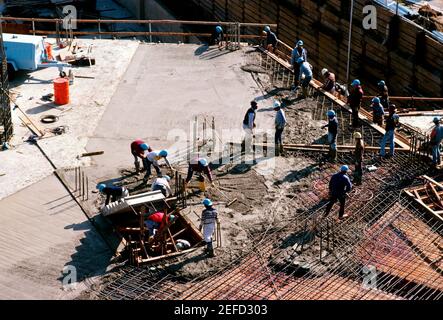 Construction workers on the construction site. Stock Photo