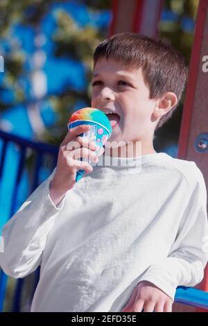 Boy licking an ice cream Stock Photo