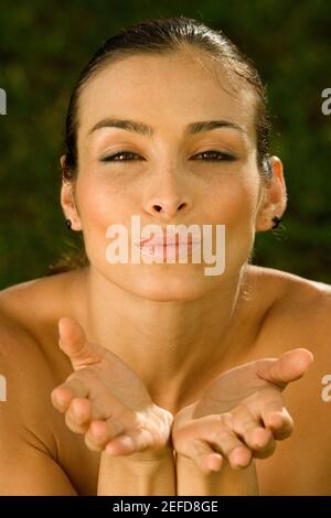Portrait of a mid adult woman puckering Stock Photo