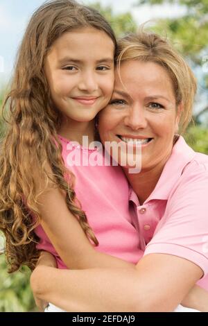 Close-up of a mother hugging her daughter Stock Photo