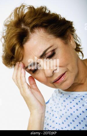 Close-up of a senior woman suffering from a headache Stock Photo