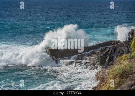 A powerful storm with big waves in the Atlantic Ocean in a bay on the coastline of Tenerife. Canary Island, Spain Stock Photo