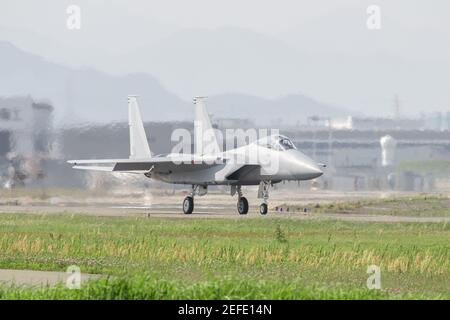 armed airplane(fighter) ready to take off on runway from airport Stock Photo