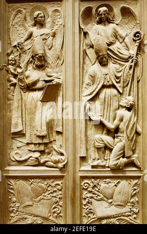 Bas relief on the door of a church, Chiesa Di Nostra Signora Della Consolazione, Genoa, Liguria, Italy Stock Photo