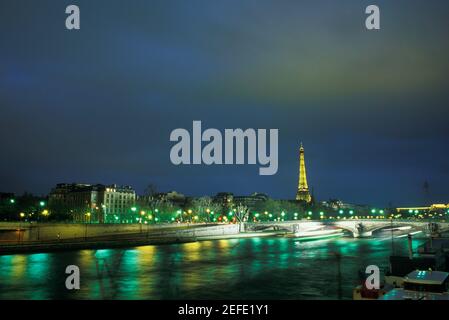Tower lit up at night, Eiffel Tower, Paris, France Stock Photo