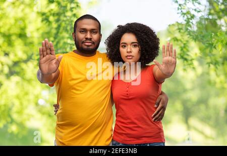 african american couple showing stop gesture Stock Photo