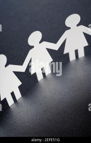 Close up of paper chain dolls Stock Photo