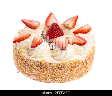 full strawberry creme pie with fruit decoration  isolated on white background Stock Photo