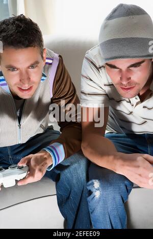 High angle view of two young men playing video game Stock Photo