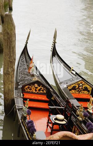 High angle view of two gondolas moored in a canal, Venice, Veneto, Italy Stock Photo