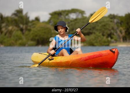 Teenage girl kayaking Stock Photo