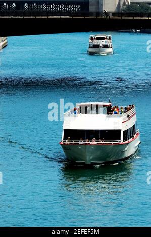 Tourist Ferry on Chicago River just passing Clark Street Bridge in ...