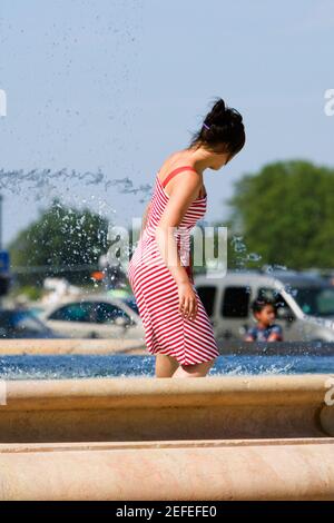 Side profile of a woman in a fountain, Bordeaux, Aquitaine, France Stock Photo