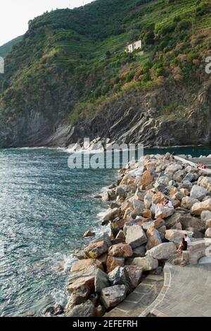 Stones at a riverside, Italian Riviera, Cinque Terre National Park, Vernazza, La Spezia, Liguria, Italy Stock Photo