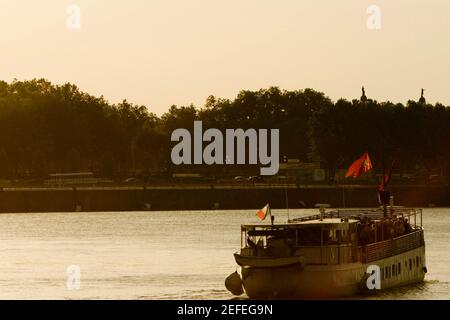 Tourboat in a river, Garonne River, Bordeaux, Aquitaine, France Stock Photo