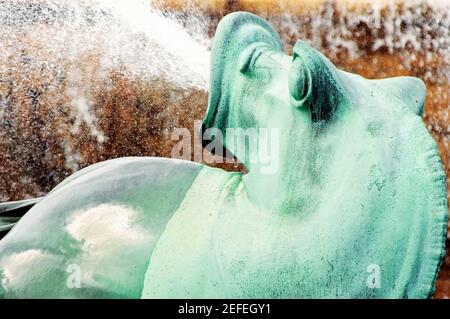 Water spraying from the mouth of a bronze statue, Clarence Buckingham Fountain, Chicago, Illinois, USA Stock Photo