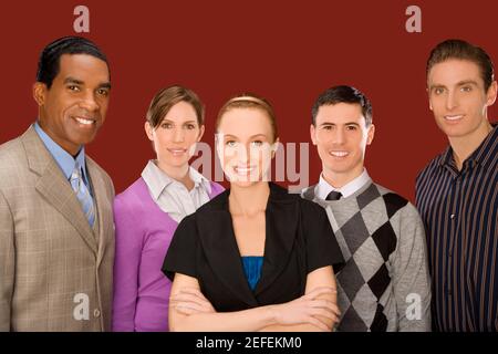 Portrait of business executives standing together and smiling Stock Photo