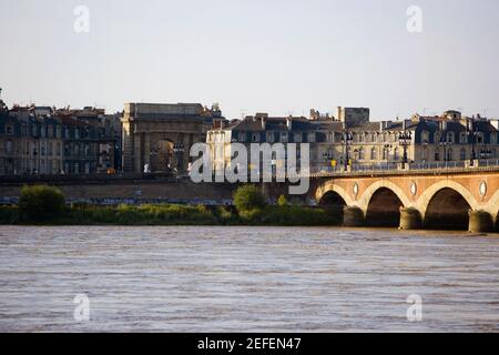 Arch bridge across a river, Pont De Pierre, Porte De Bourgogne, Garonne River, Bordeaux, Aquitaine, France