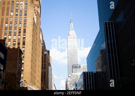 Low angle view of buildings in a city, Empire State Building, Manhattan, New York City, New York State, USA Stock Photo