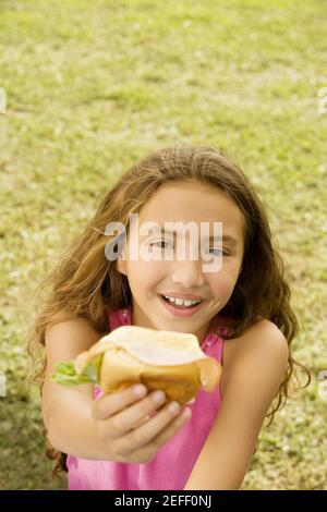 High angle view of a girl holding a burger Stock Photo