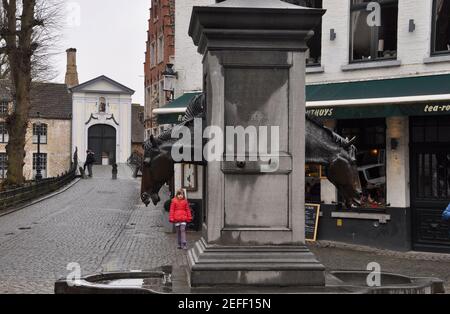 An elaborate horse drinking trough for the many horse drawn tourist carriages stiil used in Bruges,Belgium. Stock Photo