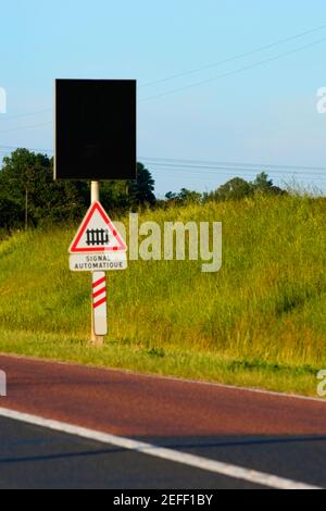 Railroad crossing signboard at the roadside, Loire Valley, France Stock Photo