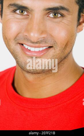 Portrait of a young man wearing a hardhat and smiling Stock Photo