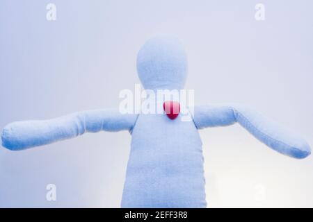 Close-up of a stuffed toy with a heart shaped candy on it Stock Photo