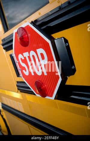 Close-up of a stop sign on a school bus Stock Photo