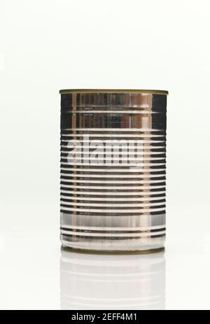 De-labelled Aluminium food cans shot on white background with reflection Stock Photo