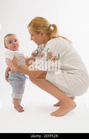 Side profile of a mid adult woman looking at her son Stock Photo
