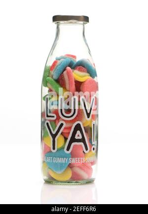 LUV YA jar of heart shape gummy sweets on whitebackground with reflection Stock Photo