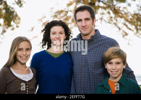 Portrait of a couple with their two children Stock Photo