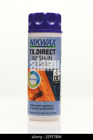 Nikwax wash-in clothes protection for adding waterproof repellency to gore tex product shot on white background with reflection. Stock Photo