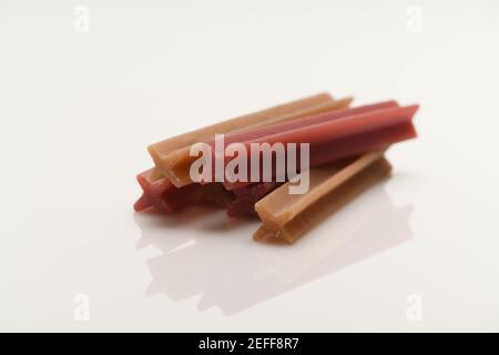 Dog teeth chews for cleaning teeth and healthy mouths. Photographed on a white background with reflection. Dentastix range from Pedigree Stock Photo