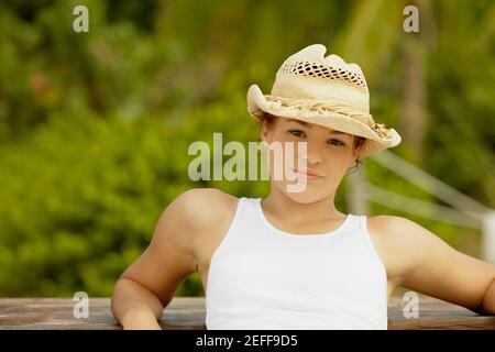 Portrait of a teenage girl wearing a sun hat Stock Photo