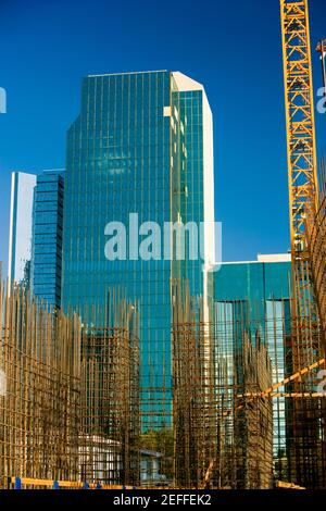 Low angle view of construction site in front of a skyscraper, Miami, Florida, USA Stock Photo