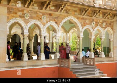 Group of people standing under an archway, Government Central Museum, Jaipur, Rajasthan, India Stock Photo